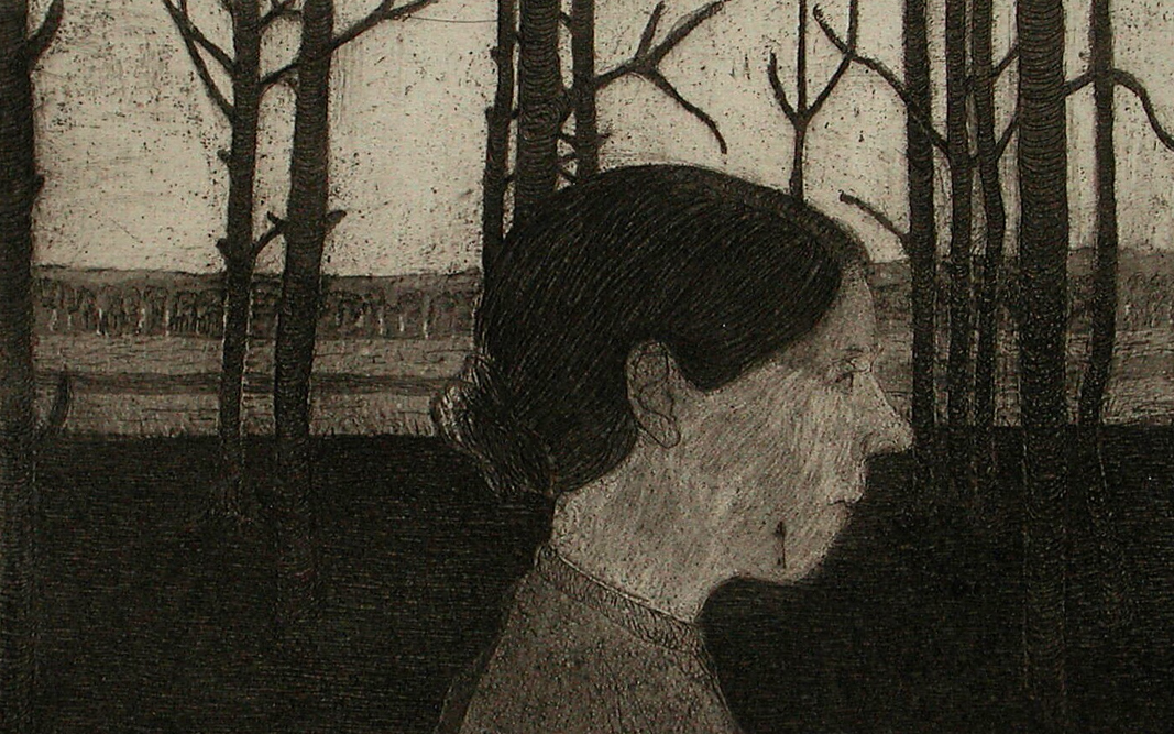 An etching of the profile of a woman