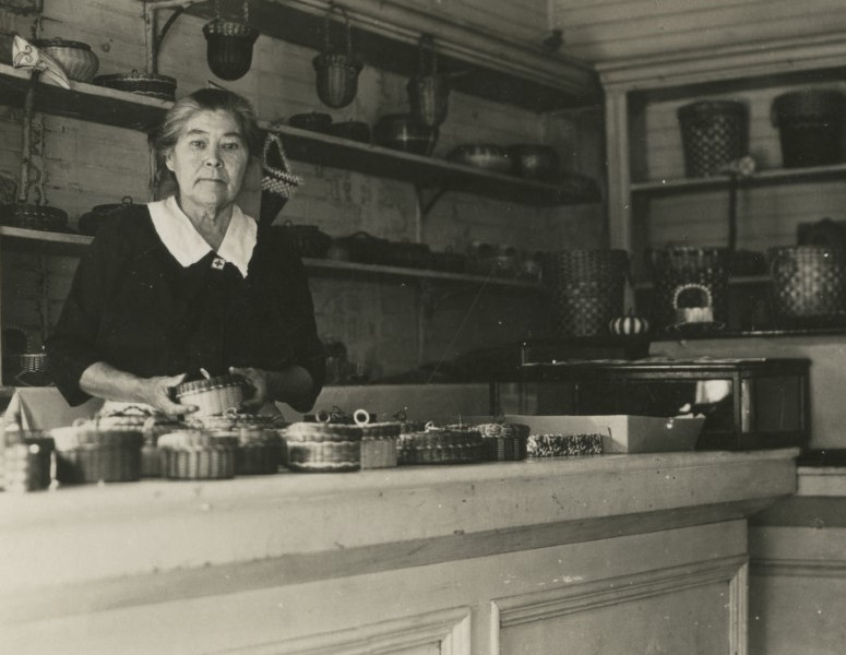 Historic photograph of woman at counter