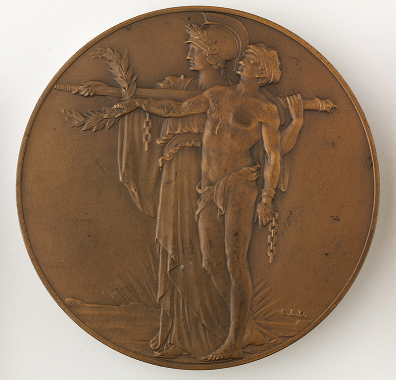 a circular object with relief renderings of two figures in classical garb