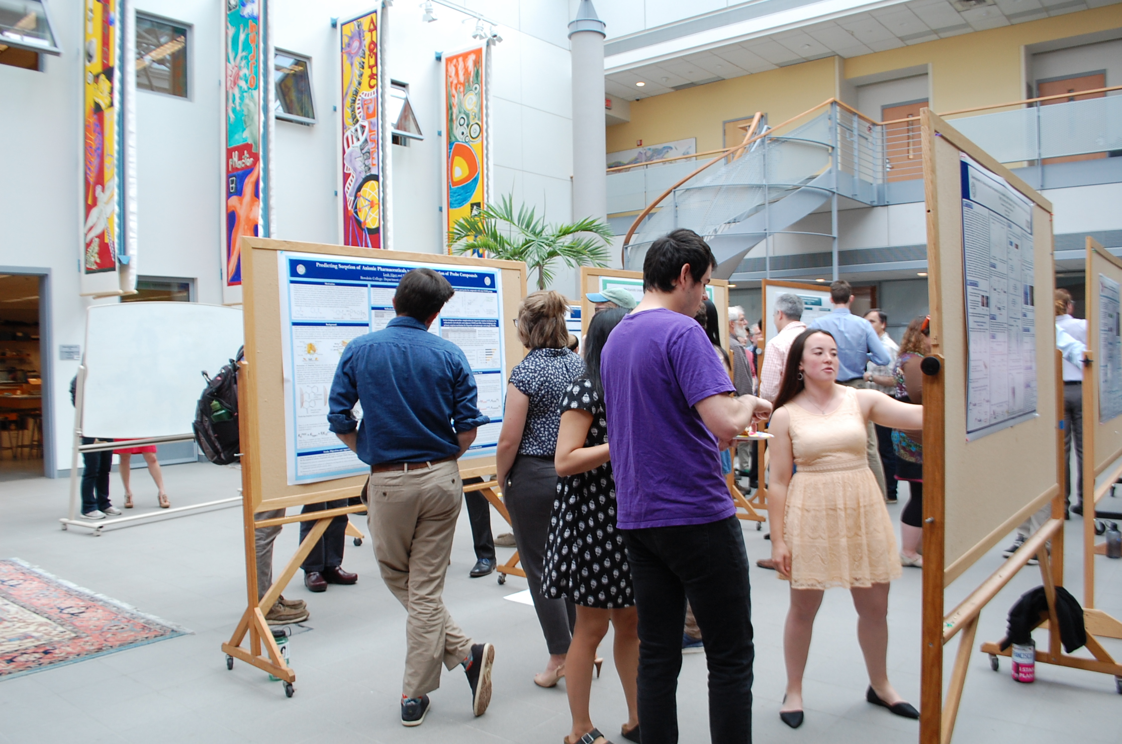 Students presenting honors posters in Druckenmiller atrium