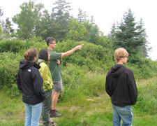 Logan and students discussing field work on Southport Island, Maine