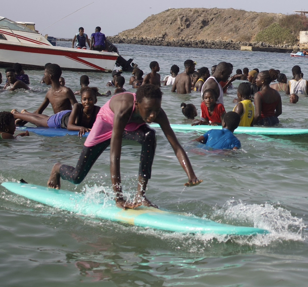 kids surfing in Senegal