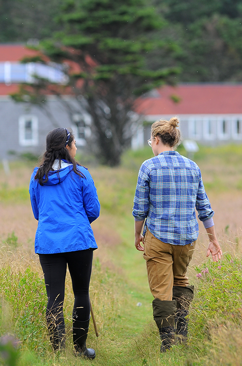 Patricia Jones walking with student