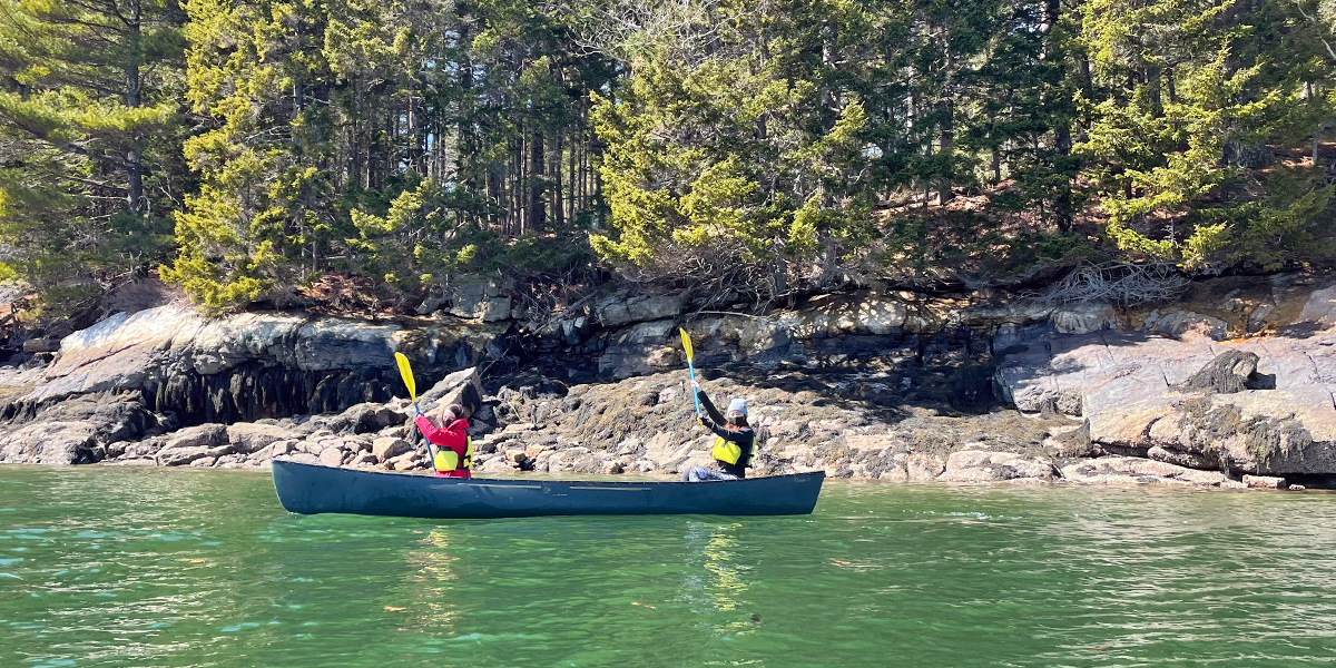 Bowdoin students canoeing on an Outing Club trip to Merritt Island.