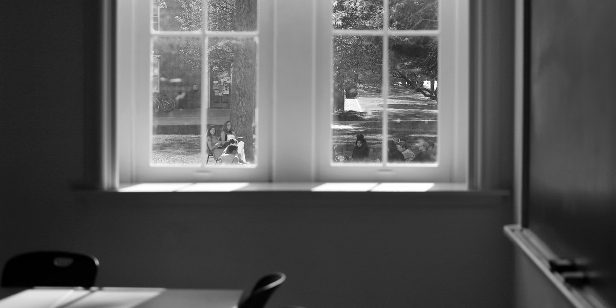 A Bowdoin class moves outdoors in the lovely fall weather.