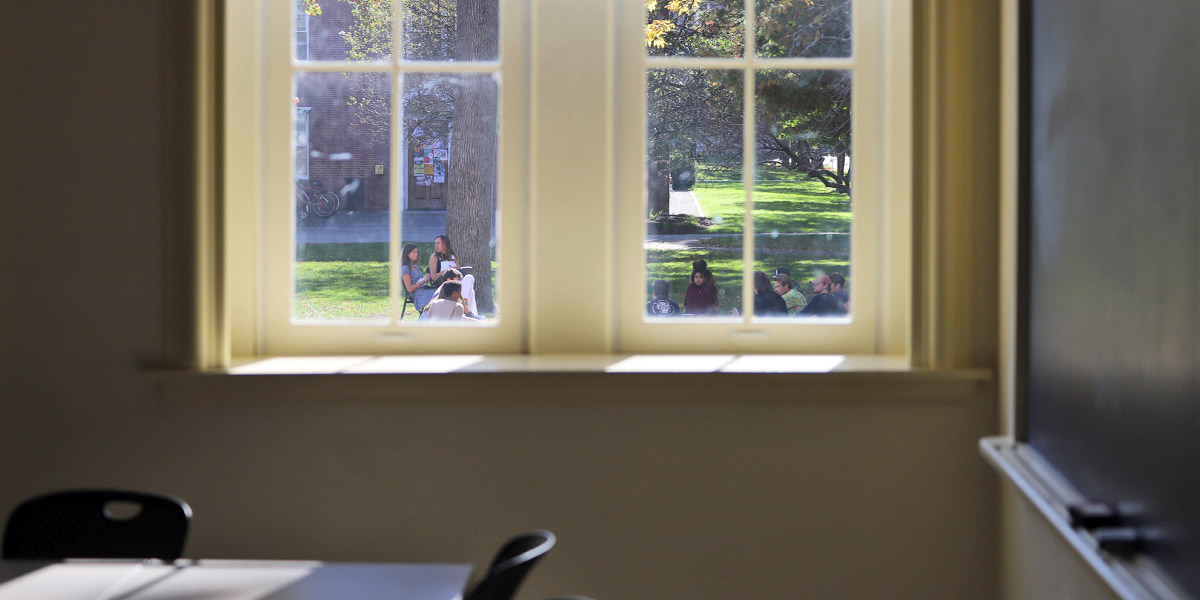 A Bowdoin class moves outdoors in the lovely fall weather.