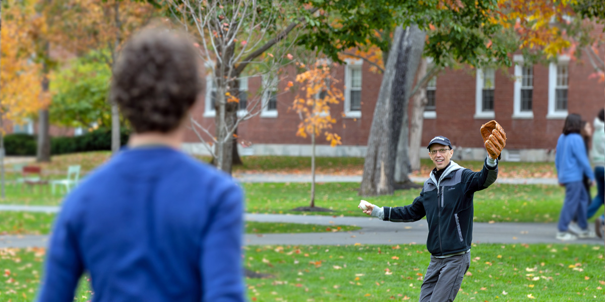 Bowdoin families and students enjoy fall weather on the Quad.