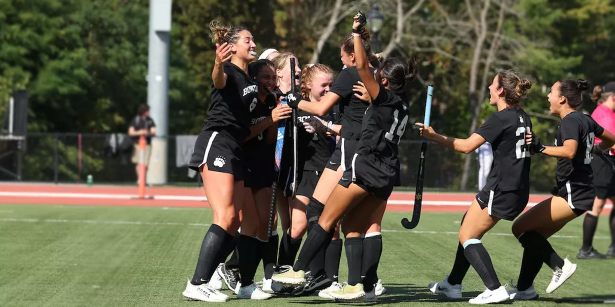 Bowdoin field hockey celebrates an overtime win over Williams.