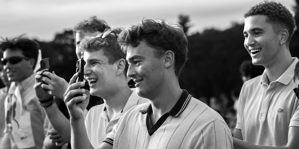 Bowdoin students take photos at the Fall Lobster Bake, an annual tradition.