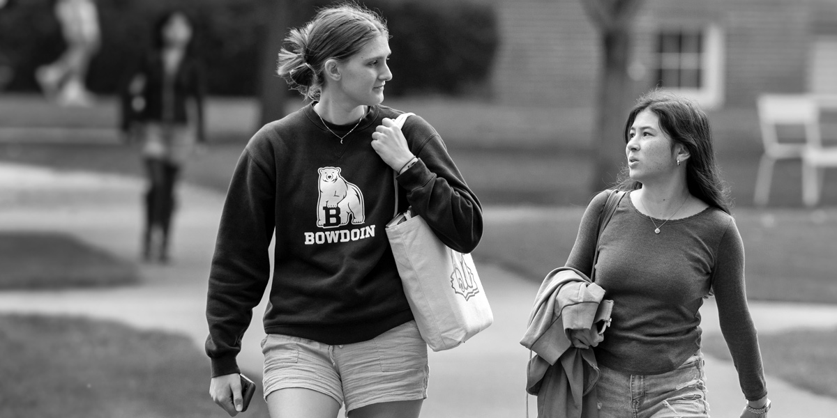 Bowdoin students enjoying the fall weather on the Quad.