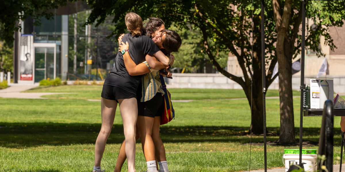 Bowdoin students greet one another upon their return to campus for the fall semester.