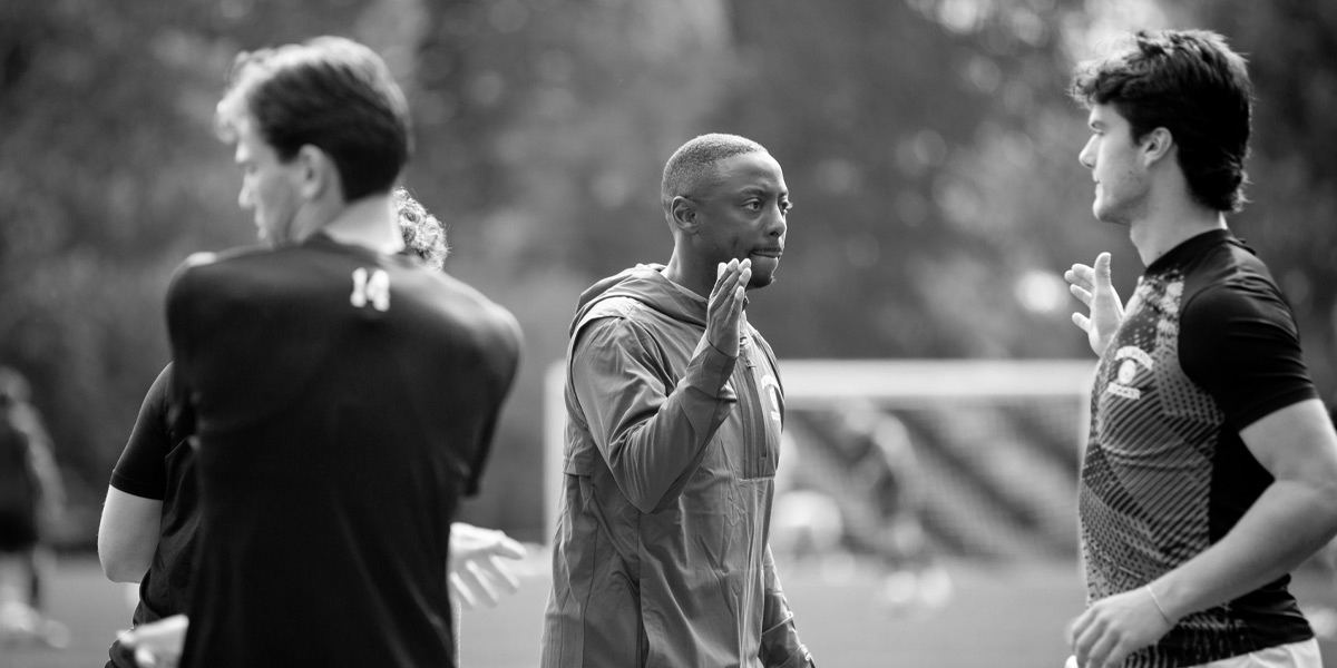 Bowdoin men's soccer rallies the team at home.