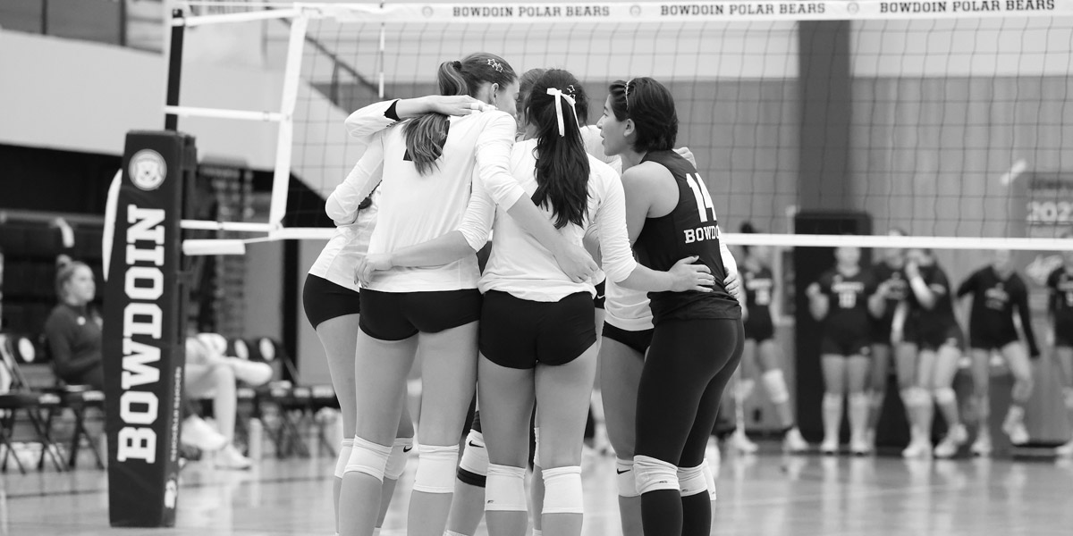 Bowdoin volleyball celebrates at home.