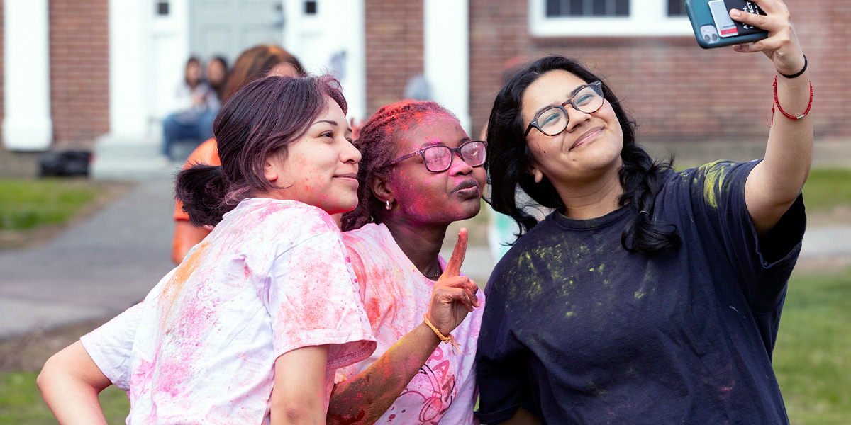 Bowdoin College students attend a colorful Holi celebration.