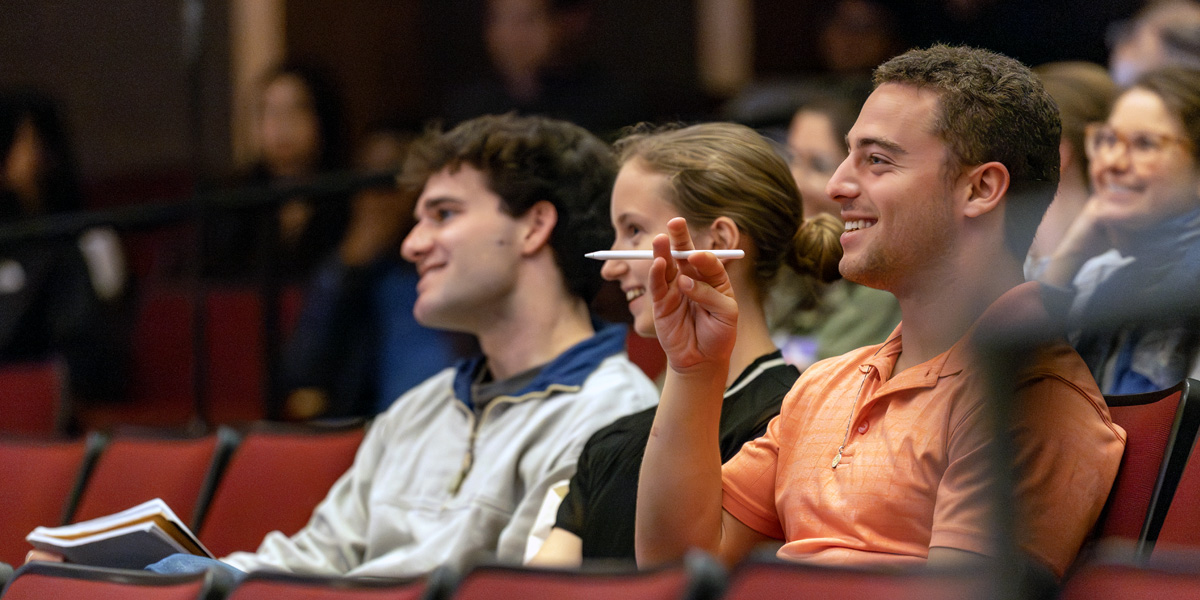 Bowdoin students listen to alumni talking about AI and leadership.