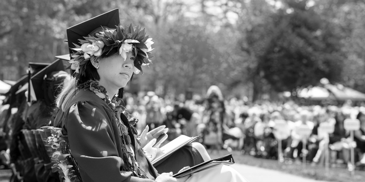 A Bowdoin senior enjoys the view at Commencement.
