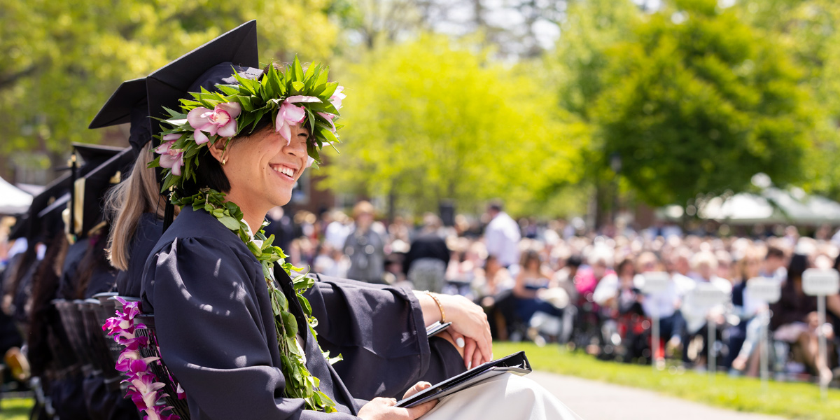 A Bowdoin senior enjoys the view at Commencement.