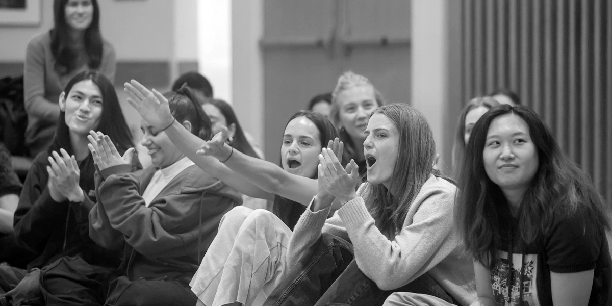 Bowdoin students cheering for one another.