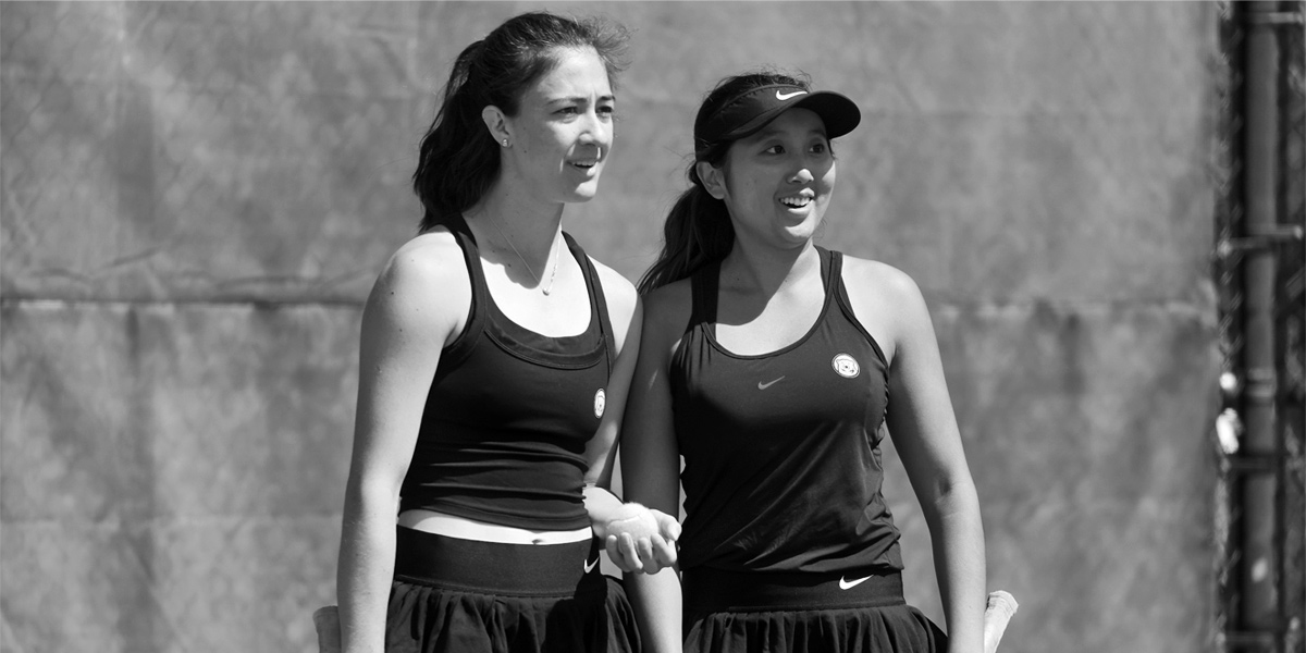 Bowdoin women's tennis celebrates a win at home.