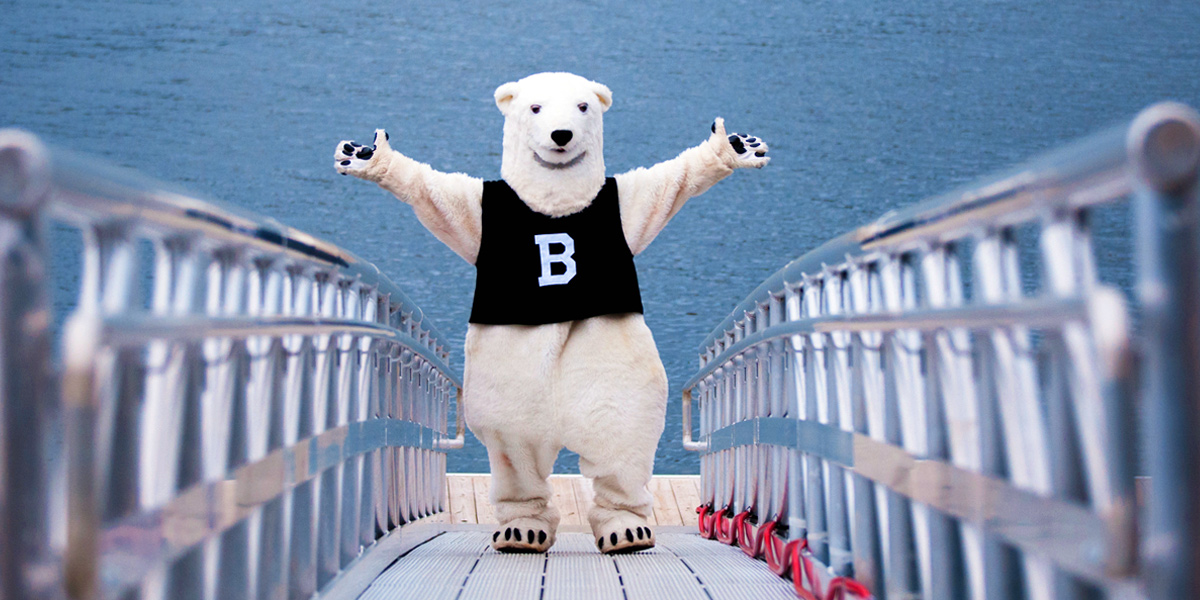 The Bowdoin Polar Bear waves from the dock at the Schiller Coastal Studies Center.