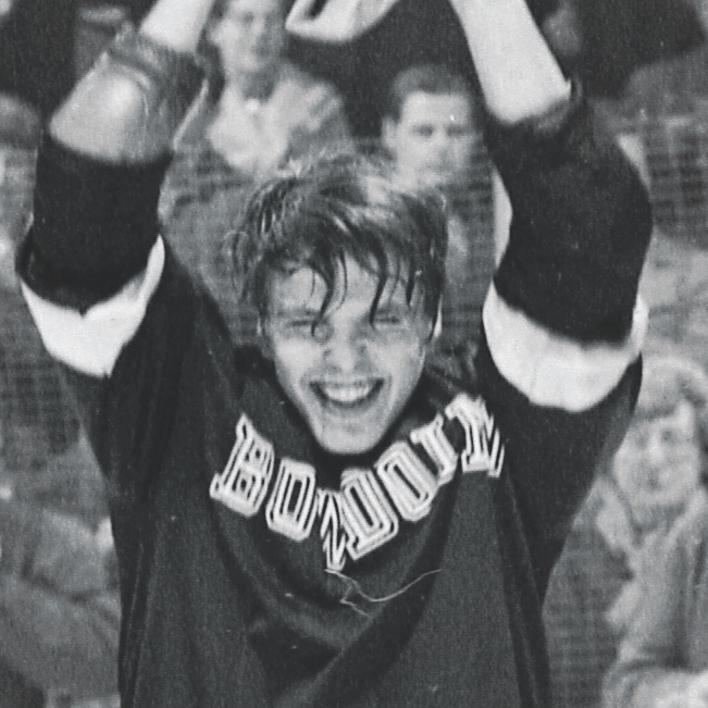 Ed Good holding up the ECAC trophy