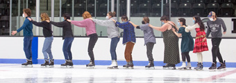 Bowdoin students ice skating in the Watson Arena.