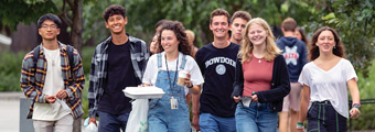 A group of new Bowdoin students walk the Quad.