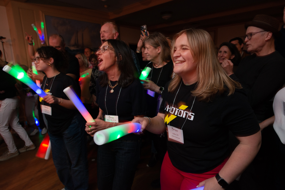 Group smiling holding glow sticks