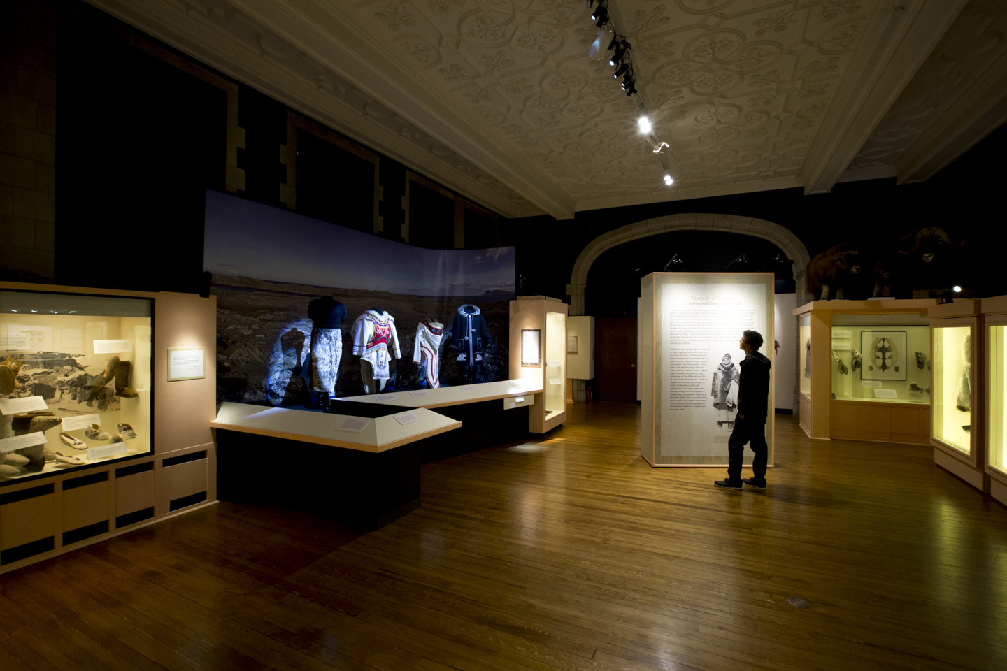 Students observing museum exhibit