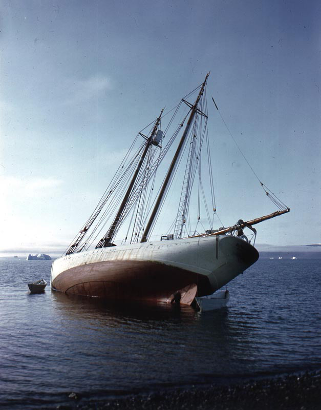 <p><b>Field Tested</b> </p>    The schooner’s strength and maneuverability were frequently tested in encounters with uncharted rocks and floating ice. Here MacMillan has beached the <em>Bowdoin</em> to repair a propeller damaged by ice. Repairs had to be improvised when the nearest shipyard was many days travel away.  <br /> <br />  Rutherford Platt, Northern Greenland, 1947. Gift of Alexander D. Platt, Rutherford Platt and Susan Platt.