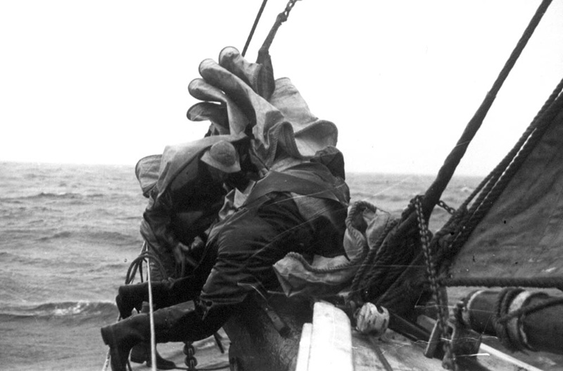 <p><b>Hauling in the Sails</b> </p>    Sailing in the far north requires hard work in all sorts of conditions. During bad weather crew members were usually too busy working to take photographs. On a number of Bartlett’s expeditions, however, professional cameramen were along to document all aspects of life aboard the <em>Morrissey</em> for news reels shown in movie theatres throughout the country.  <br /> <br />  Unidentified photographer, aboard the <em>Morrissey</em>, ca. 1930. Gift of David Nutt.