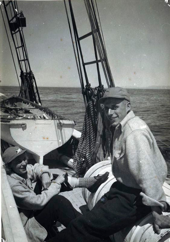 <p><b>Daily Life</b> </p>   Young crew members learned all aspects of sailing a vessel aboard the <em>Bowdoin.</em> The crew was divided into two watches, so that one half of them were on duty at all times while under way. Climbing the mast to the ice bucket, navigating the ship through fields of pack ice and helping the cook in the galley were all a regular part of their duties.   <br /> <br />  Donald B. MacMillan. Miriam MacMillan and Barney Turner, 1948. Silver gelatin print. Gift of Miriam Look MacMillan.