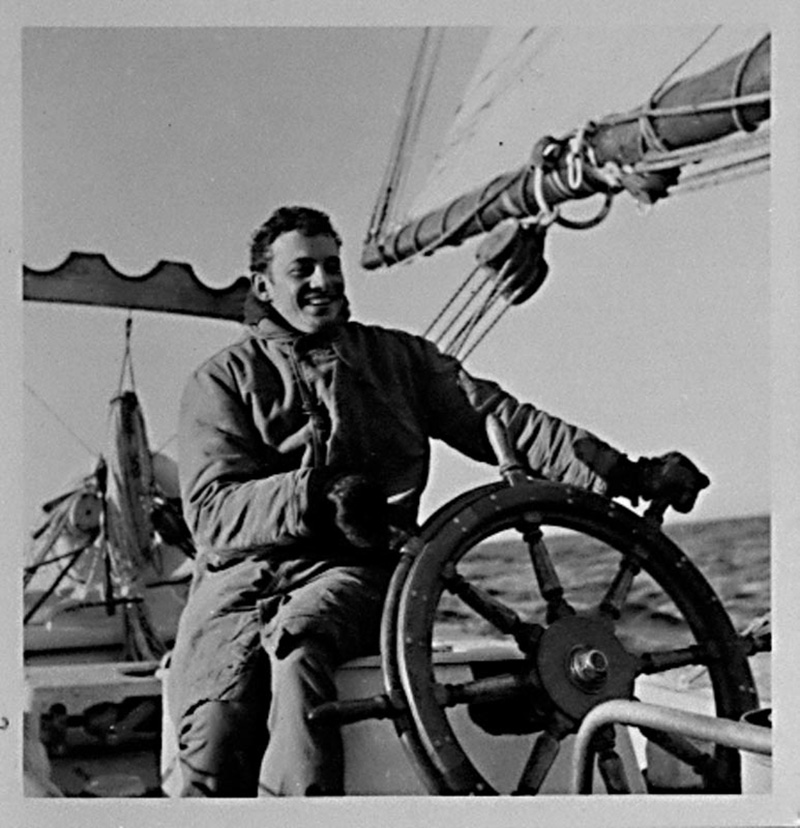 <p><b>Daily Life</b> </p>   Young crew members learned all aspects of sailing a vessel aboard the <em>Bowdoin.</em> The crew was divided into two watches, so that one half of them were on duty at all times while under way. Climbing the mast to the ice bucket, navigating the ship through fields of pack ice and helping the cook in the galley were all a regular part of their duties.   <br /> <br />  Donald B. MacMillan. Stanton Cook at the wheel of the <em> Bowdoin.</em>, 1949. Silver gelatin print. Gift of Miriam Look MacMillan. 