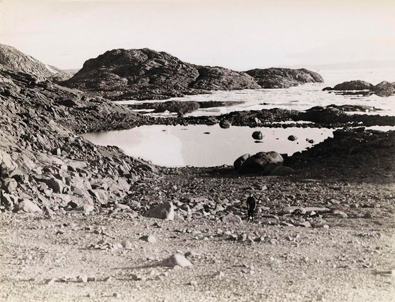 <p><b>Cape Sabine</b> </p>   In 1924, MacMillan had traveled by sledge from Greenland across Smith Sound to Cape Sabine on Ellesmere Island. There, at the site of 'Starvation Camp' he mounted a plaque commemorating Adolphus Greely's tragic expedition of 1881-84, when a number of people died. In 1950, he revisited the site for the first time, accompanied by Miriam and the rest of the crew.   <br /> <br />   Donald B. MacMillan. Site of Greely Starvation Camp, Cape Sabine, Ellesmere Island, Nunavut, 1950. Silver gelatin print. Gift of Miriam Look MacMillan.