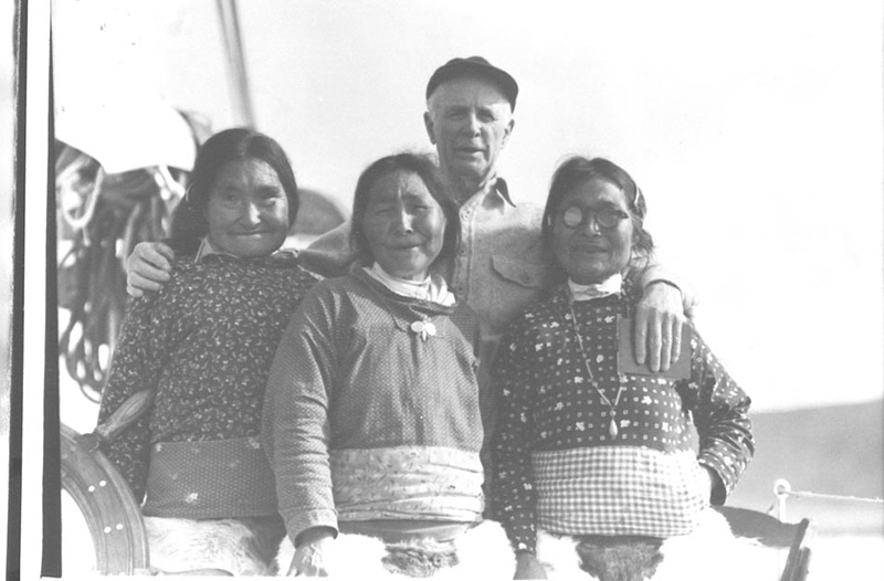<p><b>North Pole Expedition Seamstresses</b> </p>   For MacMillan and members of the crew, one of the highlights of these expeditions was visiting old friends. Here, MacMillan poses with three women who sewed clothing for the men on Robert E. Peary's 1908-09 expedition to the North Pole. MacMillan is still fondly remembered today in the communities he visited over the years.   <br /> <br />  Miriam MacMillan. Tukummeq, Ivaloo, Donald B. MacMillan, and Inugarsuk aboard the <em>Bowdoin</em>, Northwest Greenland, 1950. Silver gelatin print. Gift of Donald and Miriam MacMillan.