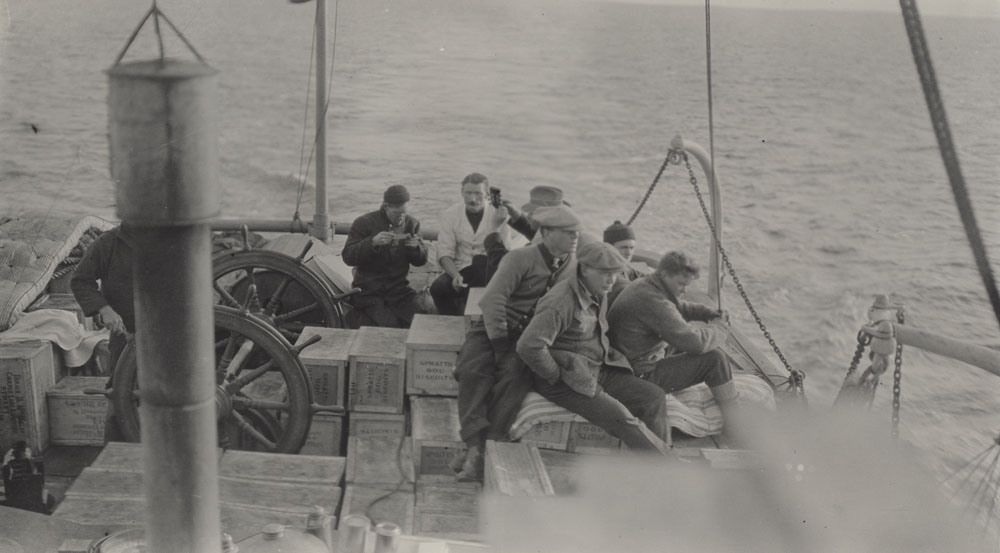 black and white photo Men working on a boat