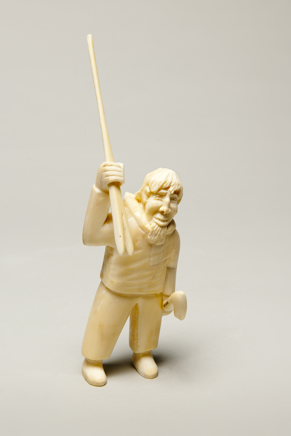 Man with hunting implement. Unidentified Inuit artist, Kangaamiut, ca. 1940. Ivory. Museum Purchase, in memory of Ankar Baregard. Photo by Dean Abramson.