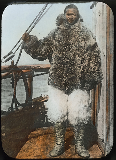 Donald B. MacMillan, Matthew A. Henson in furs on the deck of the Roosevelt.