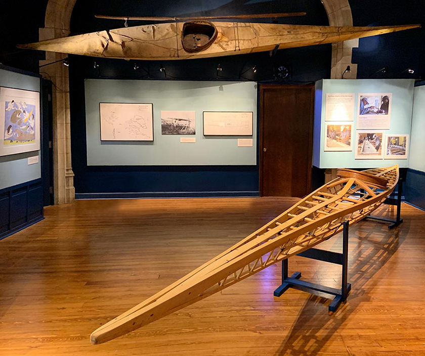 Interior of museum gallery with kayak.