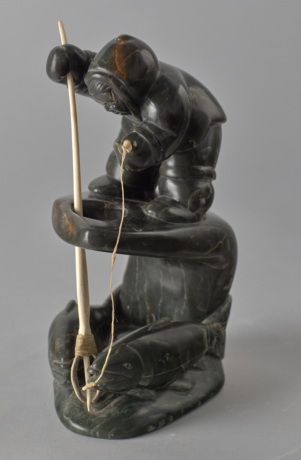 Sculpture of man fishing