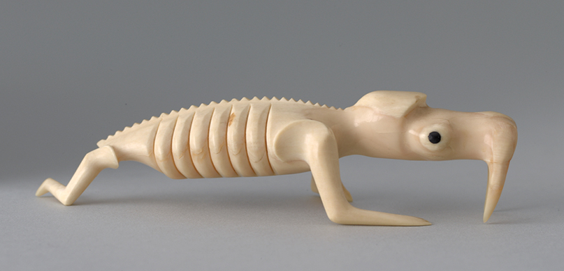 Unidentified Tunumiit Artist, Tupilaks, Tusked/Tongued Creature, and Skeletal Walrus, Kulusuk Island, Greenland, ca. 1970. Sperm whale tooth. Museum Purchase. 