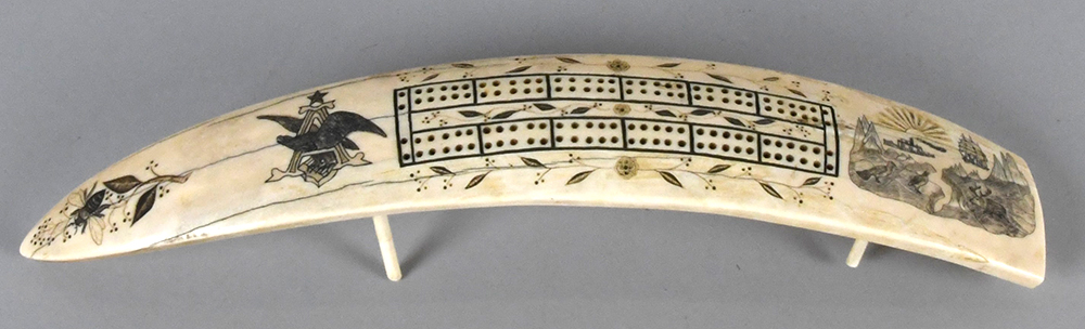 Engraved cribbage board.