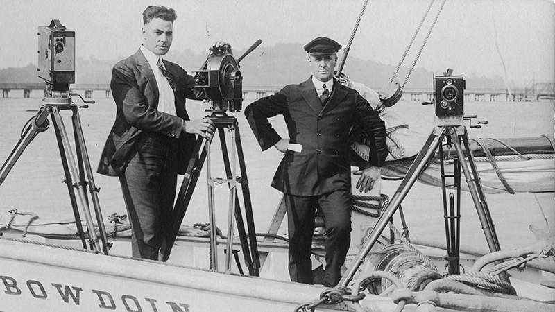 Men in boat with cameras
