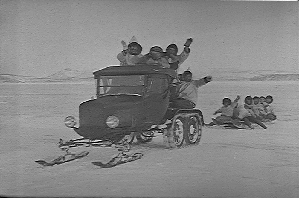 People on Arctic Snowmobile