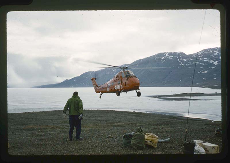 Unidentified photographer, Army Helicopter H-34 Picks up Needleman from Centrum Lake. Ice Still on Lake, Centrum Lake, northeast Greenland, June 1960. 35mm slide. Gift of Stanley Needleman.