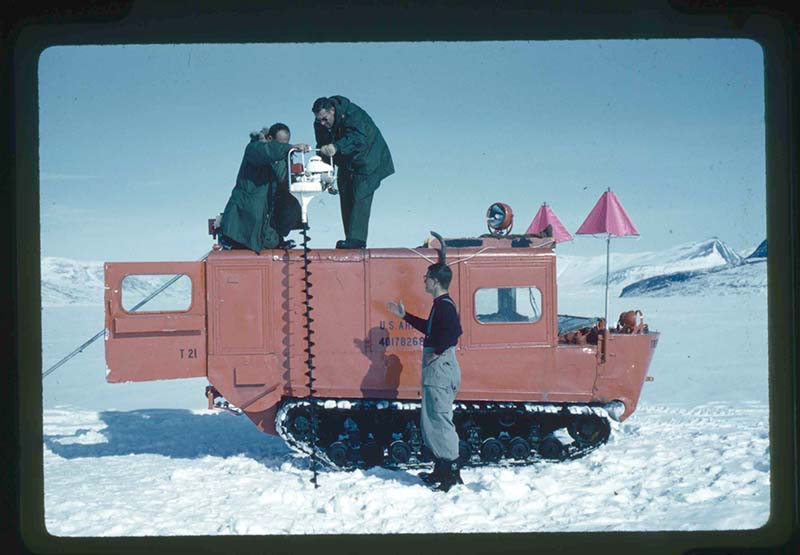 Stanley Needleman, Drilling 90 Drill Holes through the Snow and Ice Cover of Centrum Lake, Centrum Lake, northeast Greenland, June 30, 1960. 35mm slide. Gift of Stanley Needleman.