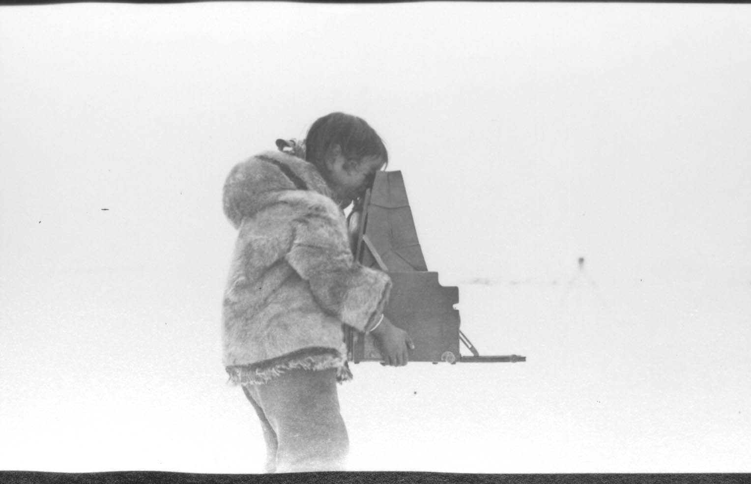 Inuit man with Graflex Camera