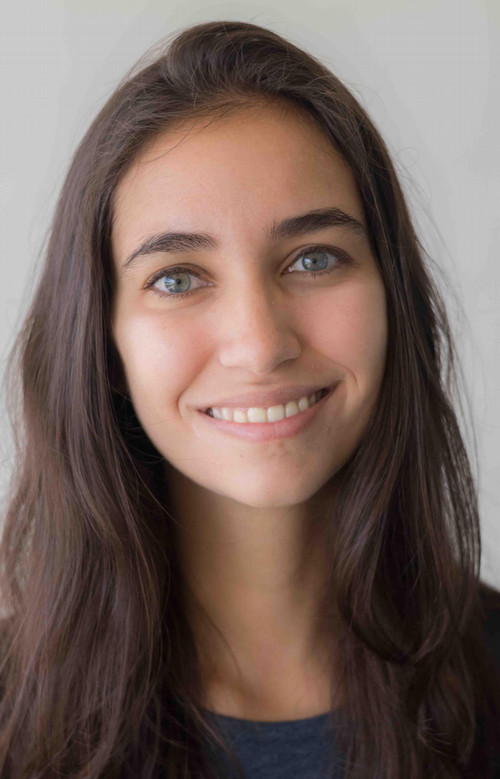 Photo of Brooke Wrubel, a closeup, smiling, with dark blue t-shirt and gray background