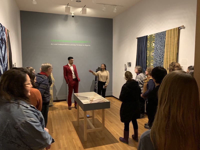 Harrison Dunne-Polite ’19 and Kinaya Hassane ’19 discuss works in the exhibition Fashioning Modernity: "Art and Independence among Yorubas in Nigeria".