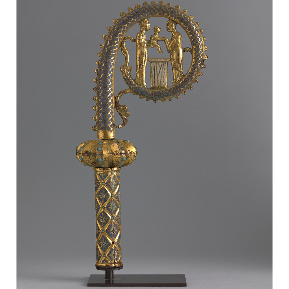 A 13th century bishops staff, made from copper, gilt copper, and champleve enamel.